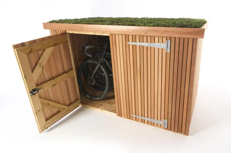 Classic wooden bike shed, slatted cedar cladding and green roof