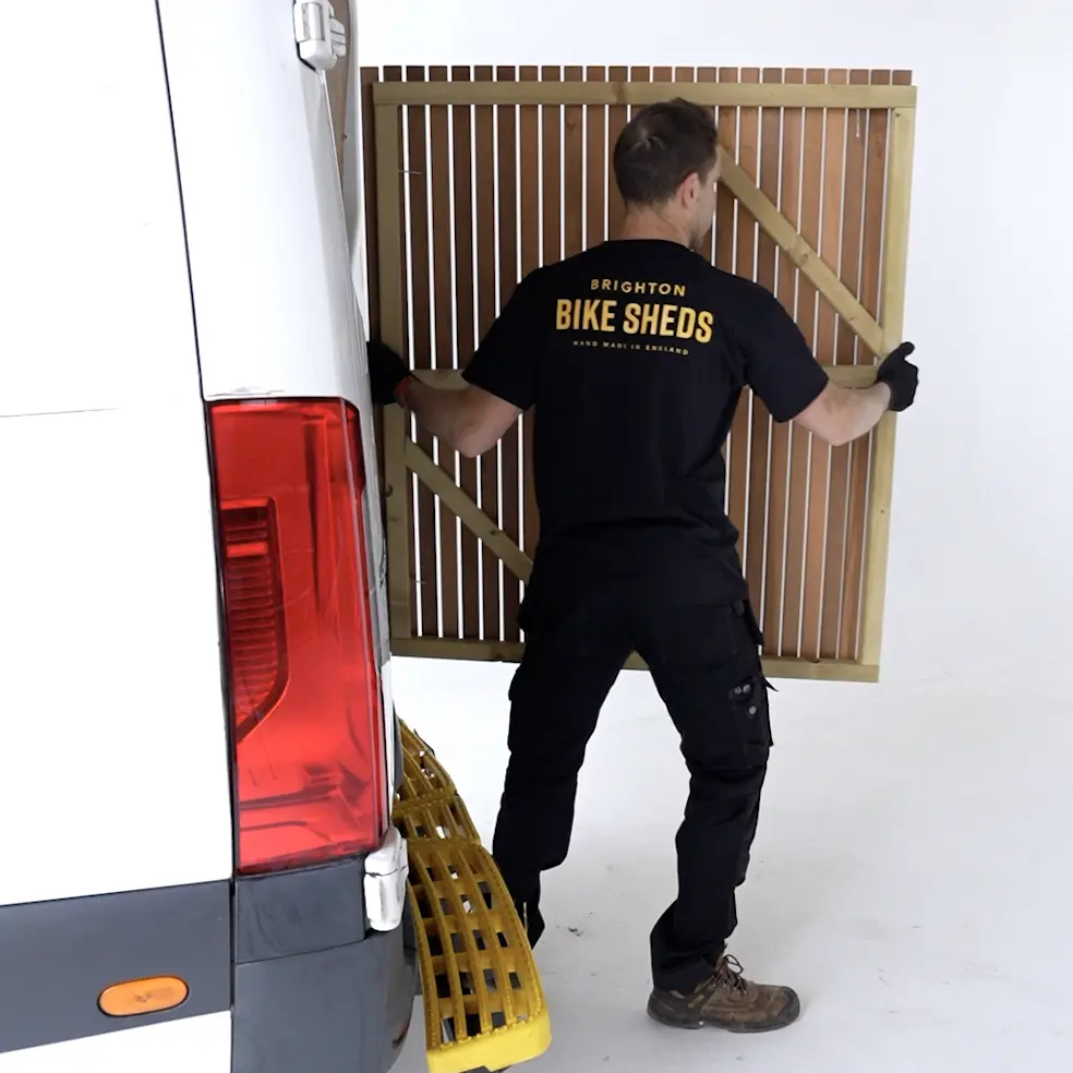 Self-assembly bike shed being built from a flat-pack kit